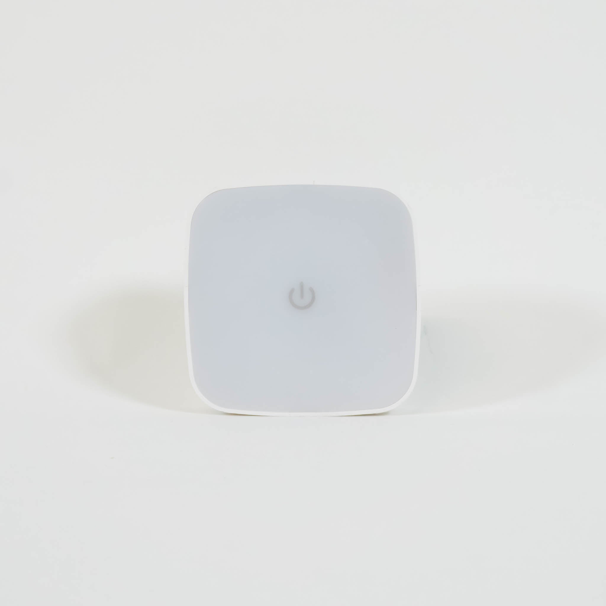 A square, white night light with rounded edges.