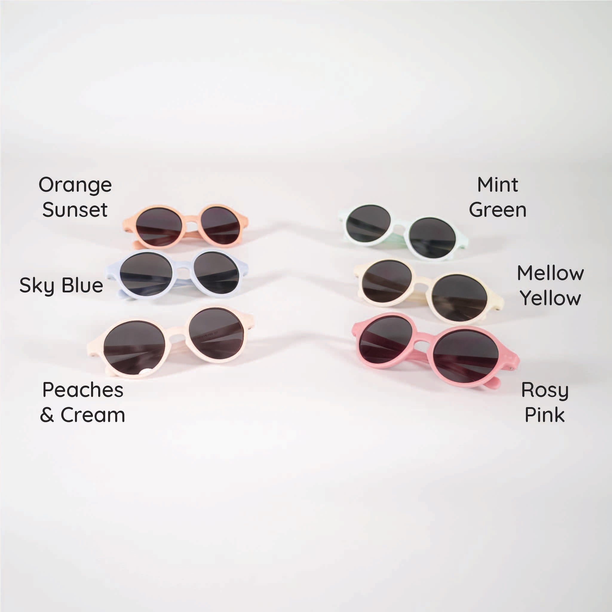 A white background with 6 baby sunglasses displayed in the following colors: orange, blue, peach, pink, yellow, green.