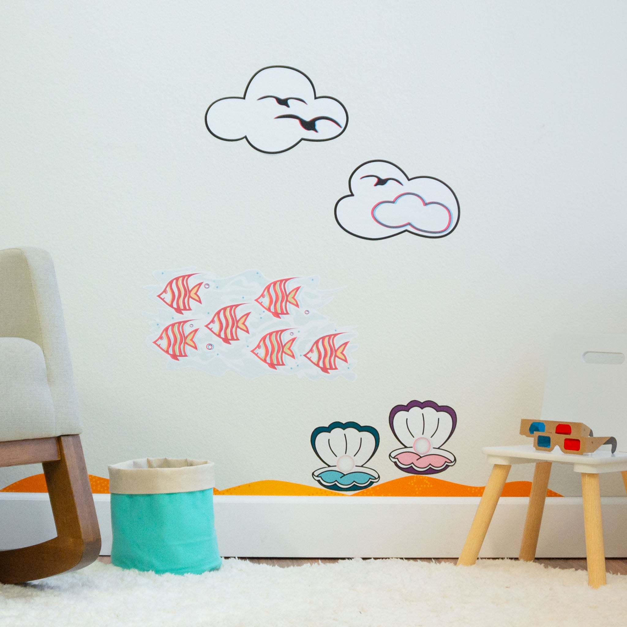 Clouds, seagulls, angelfish and oyster 3D wall art on wall with storage basket and 3D glasses in front
